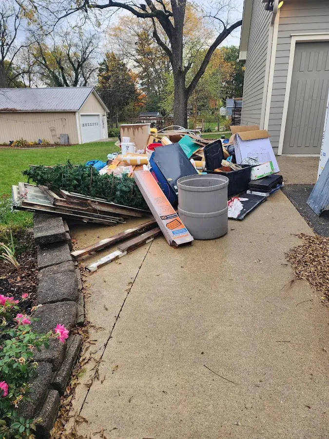 Dumpster being loaded with debris for Demolition Dumpster Rental in South Fayette